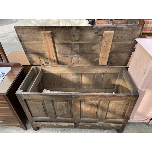 2653 - A GEORGE III OAK LANCASHIRE CHEST WITH FOUR PANEL FRONT BEARING INITIALS SI