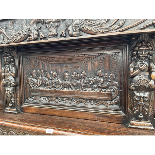 2655 - AN OAK GEORGE III STYLE COURT CUPBOARD WITH CARVED PANELS, THREE DEPICTING THE BIRTH AND CRUCIFIXION... 