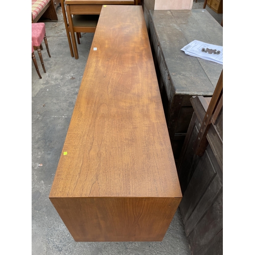 2657 - A RETRO TEAK SIDEBOARD ENCLOSING THREE DRAWERS AND FOUR CUPBOARDS BEARING TIMES FURNISHINGS LABEL