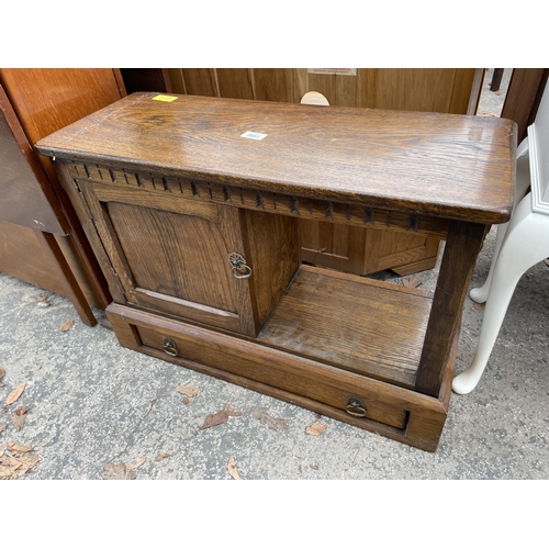 2663 - A MID 20TH CENTURY SMALL OAK TWO TIER TABLE WITH PULL THROUGH DRAWER AND CUPBOARD 28