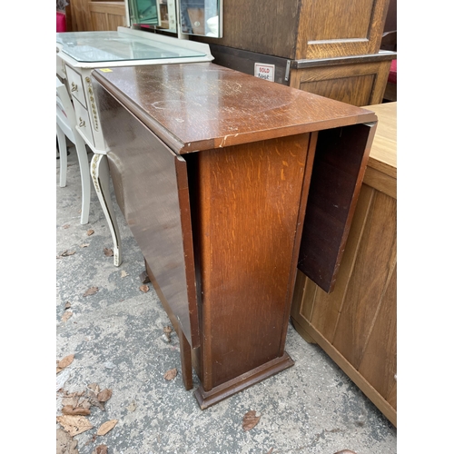 2663 - A MID 20TH CENTURY SMALL OAK TWO TIER TABLE WITH PULL THROUGH DRAWER AND CUPBOARD 28