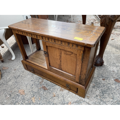 2663 - A MID 20TH CENTURY SMALL OAK TWO TIER TABLE WITH PULL THROUGH DRAWER AND CUPBOARD 28