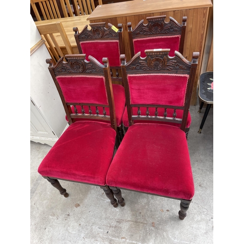 2666 - A SET OF FOUR LATE VICTORIAN UPHOLSTERED DINING CHAIRS WITH CARVED TOP RAILS AND TURNED FRONT LEGS