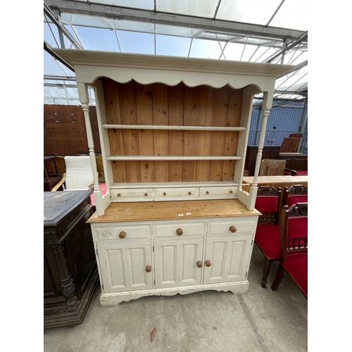 2667 - A PAINTED PINE KITCHEN DRESSER WITH PLATE RACK ENCLOSING THREE DRAWERS 54