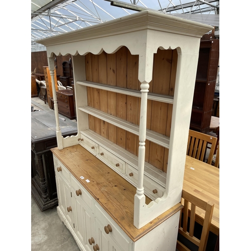 2667 - A PAINTED PINE KITCHEN DRESSER WITH PLATE RACK ENCLOSING THREE DRAWERS 54