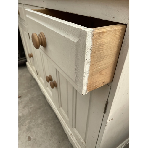 2667 - A PAINTED PINE KITCHEN DRESSER WITH PLATE RACK ENCLOSING THREE DRAWERS 54