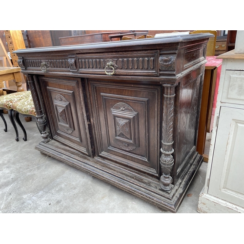 2668 - A HEAVILY CARVED VICTORIAN OAK SIDEBOARD ENCLOSING TWO DRAWERS AND CUPBAORDS  52