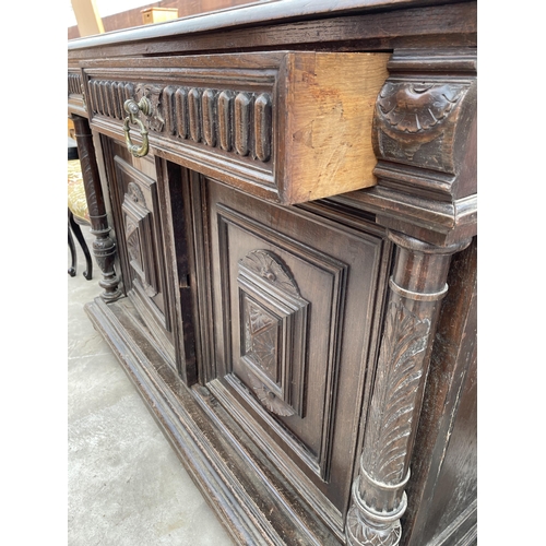 2668 - A HEAVILY CARVED VICTORIAN OAK SIDEBOARD ENCLOSING TWO DRAWERS AND CUPBAORDS  52