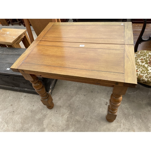 2670 - A MID 20TH CENTURY OAK FOLD OVER TABLE