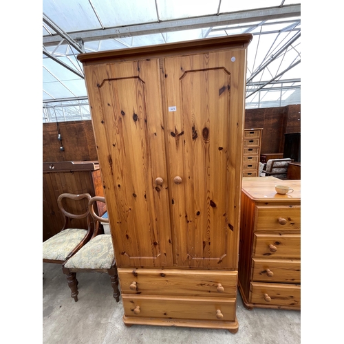 2675 - A PINE TWO DOOR WARDROBE WITH TWO DRAWERS TO BASE