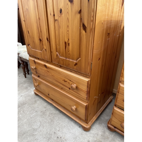 2675 - A PINE TWO DOOR WARDROBE WITH TWO DRAWERS TO BASE