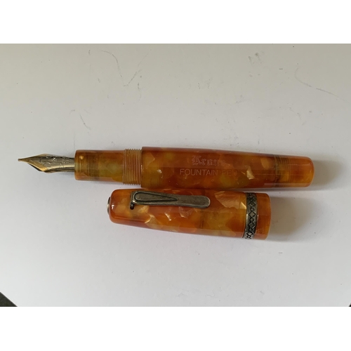 507 - AN ORANGE KRONE FOUNTAIN PEN WITH 18 CARAT GOLD NIB