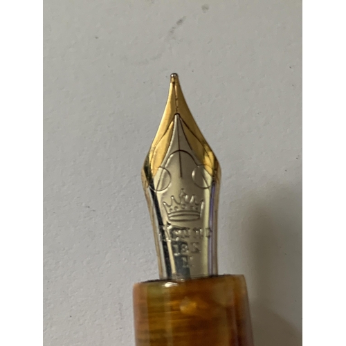 507 - AN ORANGE KRONE FOUNTAIN PEN WITH 18 CARAT GOLD NIB