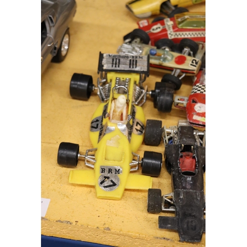 384 - EIGHT LARGER SCALE VINTAGE 1970S F1 RACING CARS