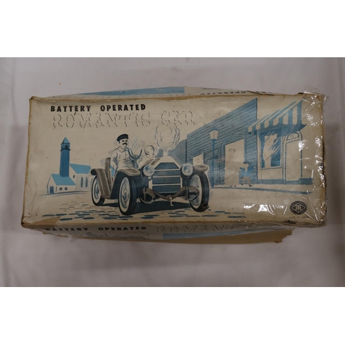 392 - A VINTAGE BOXED, BATTERY OPERATED, TIN PLATE CAR