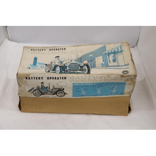 392 - A VINTAGE BOXED, BATTERY OPERATED, TIN PLATE CAR