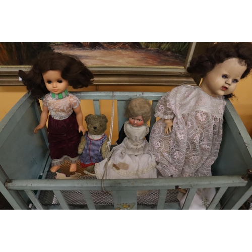 398 - A VINTAGE DOLL'S COT WITH THREE DOLLS, ONE A PALITOY AND A TEDDY BEAR