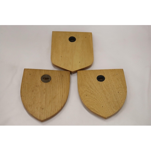 811 - THREE BUSINESS/INDUSTRY WOODEN PLAQUES