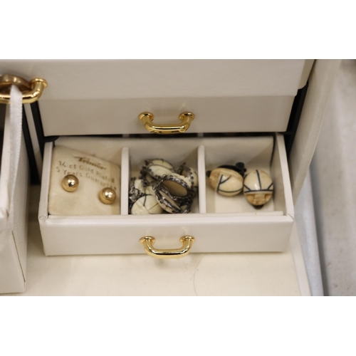 825 - A JEWELLERY BOX CONTAINING A LARGE QUANTITY OF COSTUME JEWELLERY