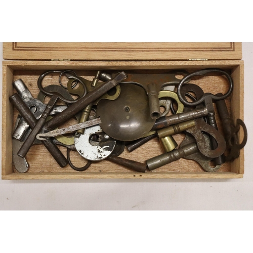 876 - A BOX OF VINTAGE CLOCK KEYS