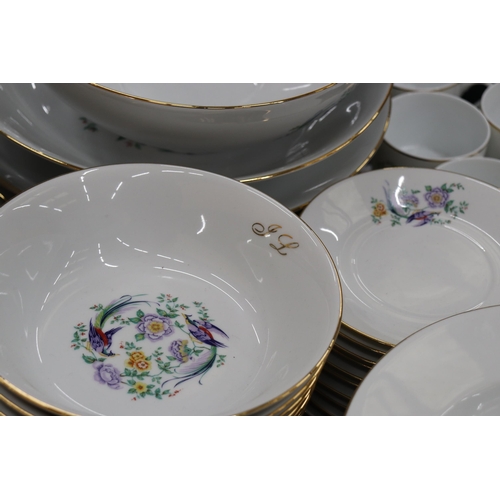 880 - A LARGE LIMOGES DINNER SERVICE WITH BIRDS OF PARADISE DESIGN TO INCLUDE, VARIOUS SIZES OF PLATES, A ... 