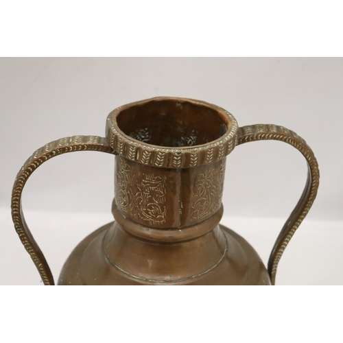 882 - A SIGNED TWIN HANDLED EASTERN COPPER POT