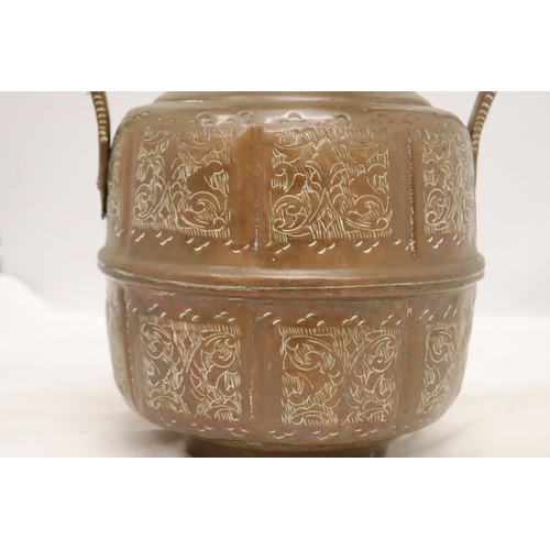 882 - A SIGNED TWIN HANDLED EASTERN COPPER POT