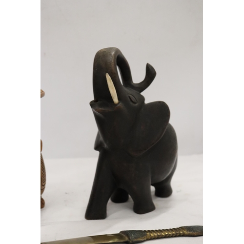 895 - A HARDWOOD CARVED ELEPHANT, STONE ELEPHANT, MISSING A LEG AND A BRASS KNIFE