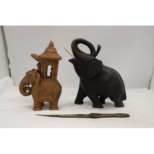 895 - A HARDWOOD CARVED ELEPHANT, STONE ELEPHANT, MISSING A LEG AND A BRASS KNIFE