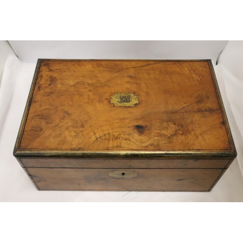 902 - A BRASS BOUND WRITING BOX WITH SECRET DRAWERS, LEATHER TOOLED SLOPE WITH ONE INKWELL