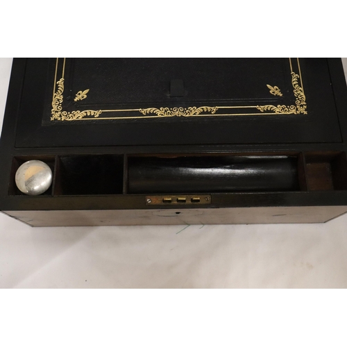 902 - A BRASS BOUND WRITING BOX WITH SECRET DRAWERS, LEATHER TOOLED SLOPE WITH ONE INKWELL