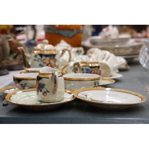 906 - AN ART DECO CHILD'S TEASET WITH CHILDREN'S CHARACTERS TO INCLUDE A TEAPOT, SUGAR BOWL, CREAM JUG, CU... 