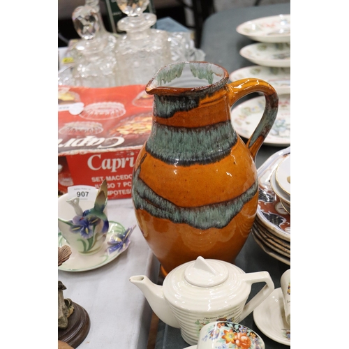 906 - AN ART DECO CHILD'S TEASET WITH CHILDREN'S CHARACTERS TO INCLUDE A TEAPOT, SUGAR BOWL, CREAM JUG, CU... 