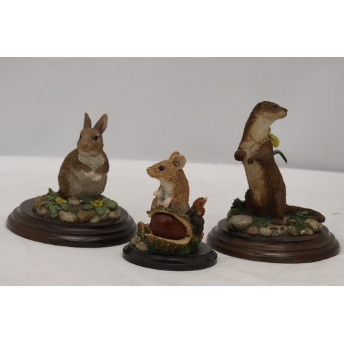 930 - THREE ANIMAL FIGURES ON PLINTHS BY ROYAL DOULTON