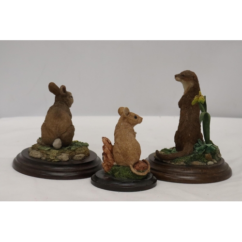 930 - THREE ANIMAL FIGURES ON PLINTHS BY ROYAL DOULTON