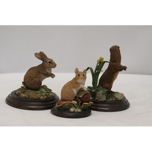 930 - THREE ANIMAL FIGURES ON PLINTHS BY ROYAL DOULTON