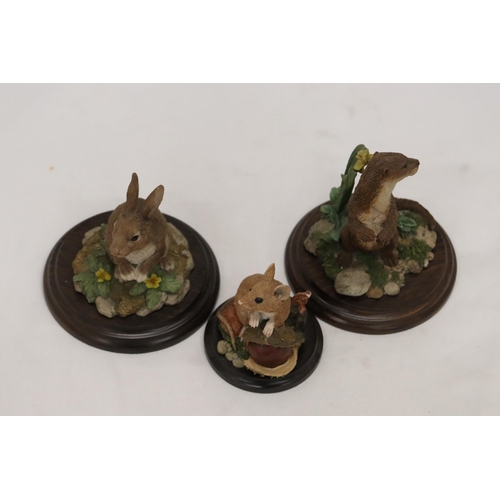 930 - THREE ANIMAL FIGURES ON PLINTHS BY ROYAL DOULTON