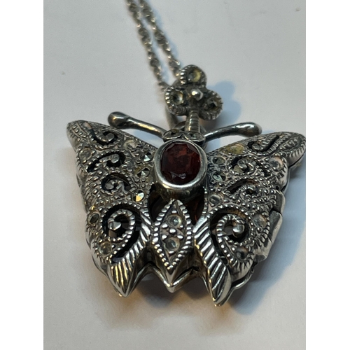 678 - A MARKED 925 SILVER ORNATE BUTTERFLY LOCKET ON A CHAIN