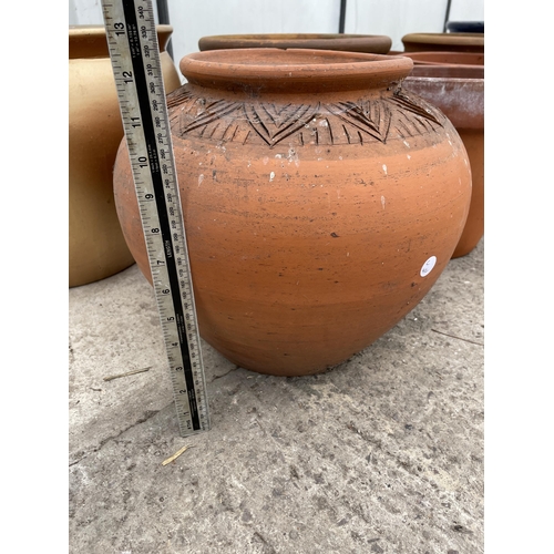 1666 - A TERRACOTTA PLANTER AND A FURTHER GILT TERRACOTTA PLANTER