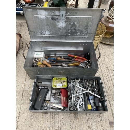 1729 - A METAL TOOL BOX WITH AN ASSORTMENT OF TOOLS TO INCLUDE SPANNERS, DRILL BITS AND PLIERS ETC