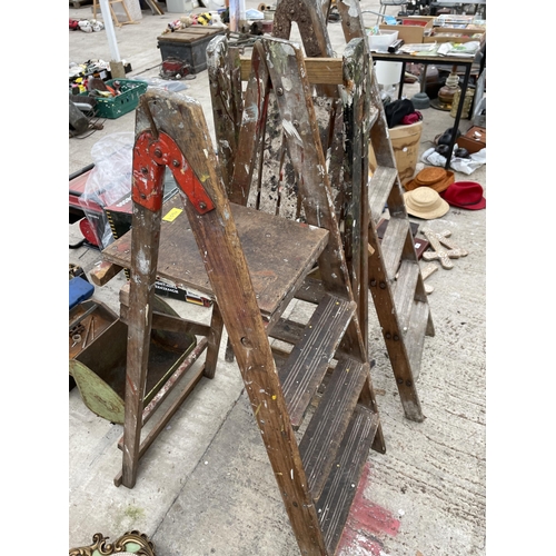 1734 - THREE VARIOUS VINTAGE WOODEN STEP LADDERS