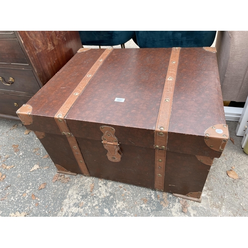 2897 - A MODERN TRUNK WITH LEATHER STRAPS