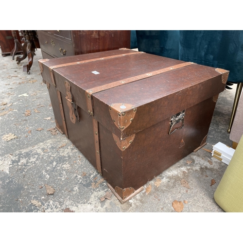 2897 - A MODERN TRUNK WITH LEATHER STRAPS