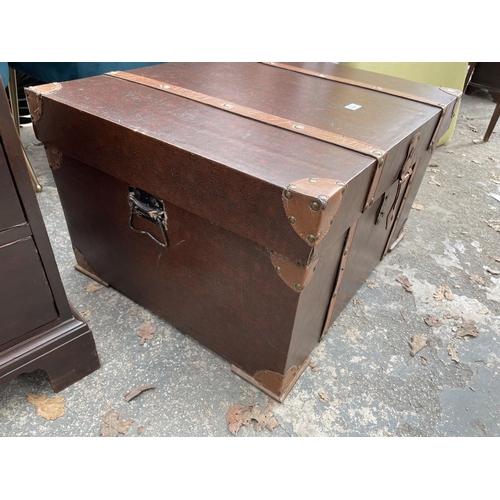 2897 - A MODERN TRUNK WITH LEATHER STRAPS