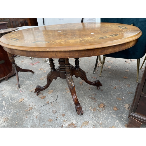 2899 - A VICTORIAN WALNUT AND INLAID OVAL TILT TOP TABLE ON FOUR TURNED SUPPORTS AND CENTRAL COLUMN 52