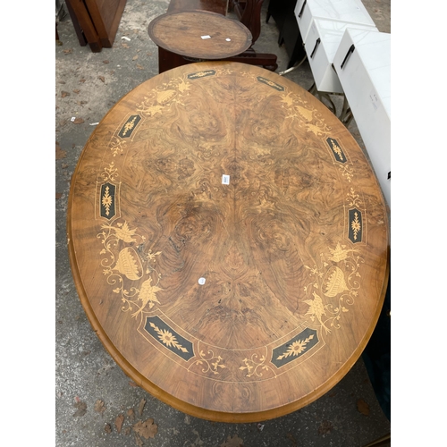 2899 - A VICTORIAN WALNUT AND INLAID OVAL TILT TOP TABLE ON FOUR TURNED SUPPORTS AND CENTRAL COLUMN 52