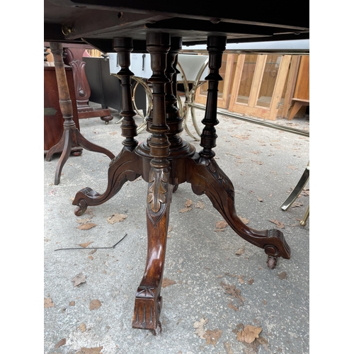 2899 - A VICTORIAN WALNUT AND INLAID OVAL TILT TOP TABLE ON FOUR TURNED SUPPORTS AND CENTRAL COLUMN 52