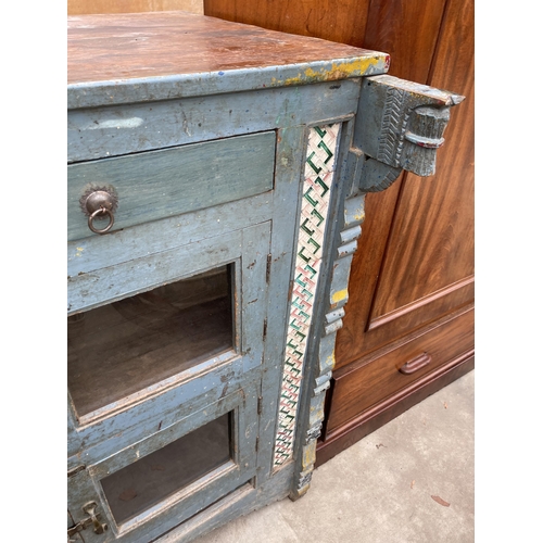 2936 - A VINTAGE INDIAN HARDWOOD CABINET ENCLOSING FOUR GLAZED CUPBOARDS AND TWO DRAWERS WITH INSET COLOURE... 