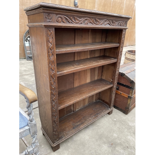 2943 - A VICTORIAN HEAVILT CARVED OPEN FOUR TIER OPEN BOOKCASE 36