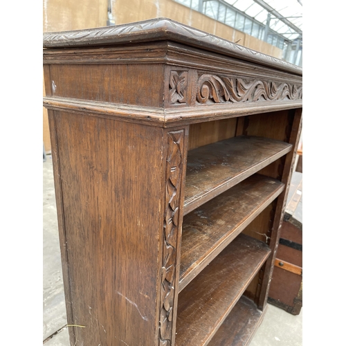 2943 - A VICTORIAN HEAVILT CARVED OPEN FOUR TIER OPEN BOOKCASE 36